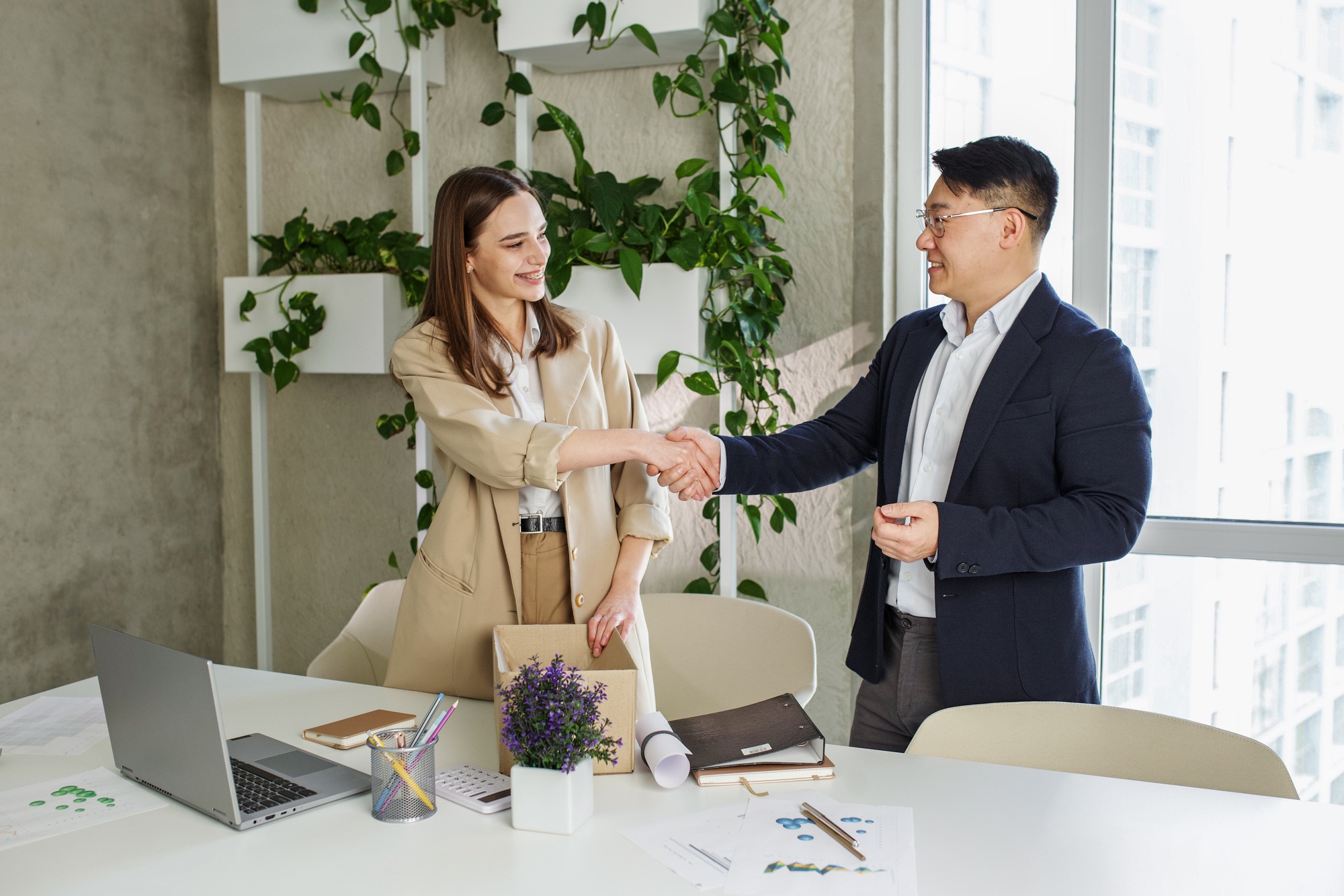 Job position acceptance. Happy woman getting new job offer indoors in modern office, holding box
